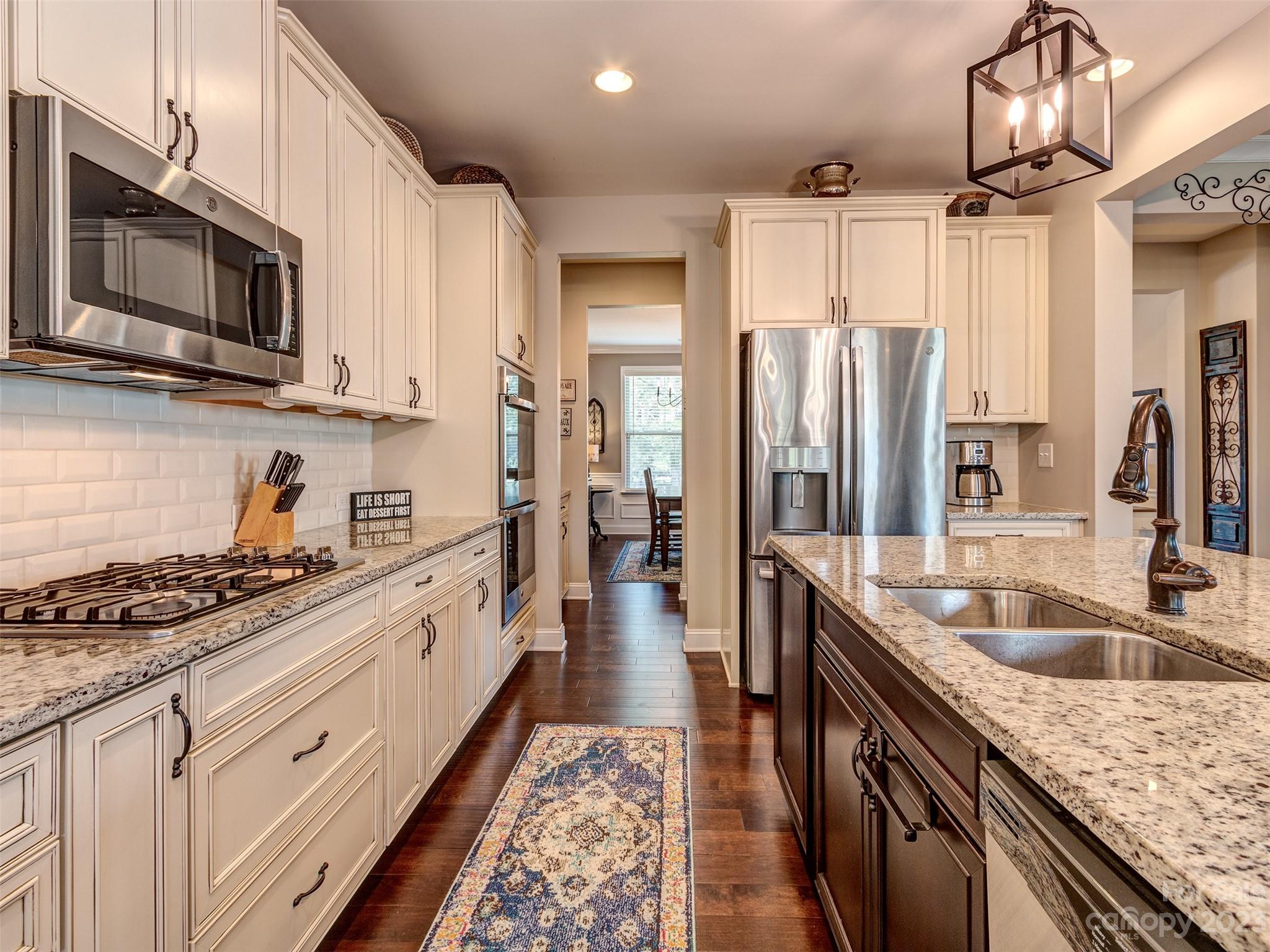 5515 Braddock Ml Way Lancaster, SC 29720 - Photo 4 of 41 a large kitchen with stainless steel appliances granite countertop a lot of counter space and wooden floors