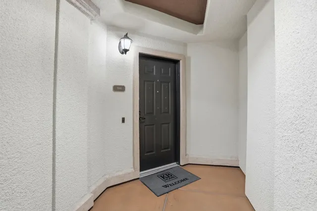 a view of livingroom with furniture and a potted plant