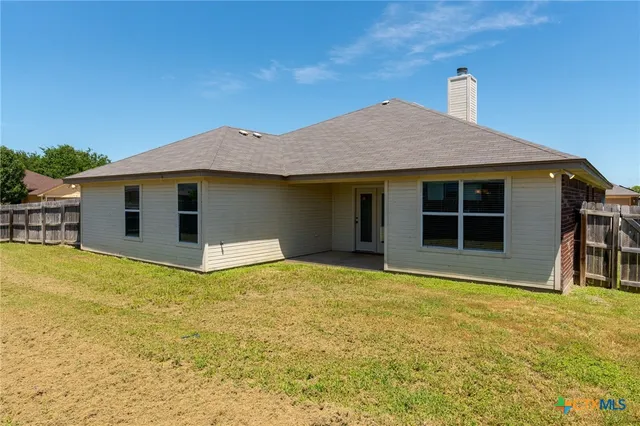 a house with yard in front of it
