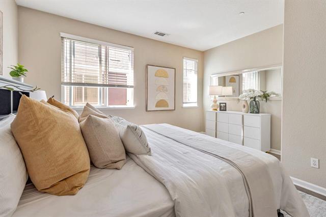907 Rancho Place San Jose, CA 95126 - Photo 22 of 31 a spacious bedroom with a bed and glass windows