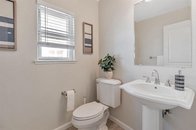 907 Rancho Place San Jose, CA 95126 - Photo 26 of 31 a bathroom with a sink toilet and a mirror
