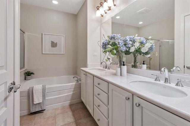 907 Rancho Place San Jose, CA 95126 - Photo 28 of 31 a bathroom with a bathtub sink and mirror