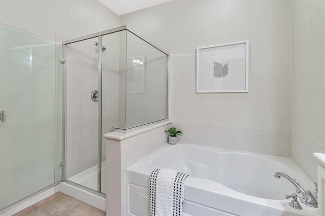 907 Rancho Place San Jose, CA 95126 - Photo 29 of 31 a bathroom with a bathtub and a shower
