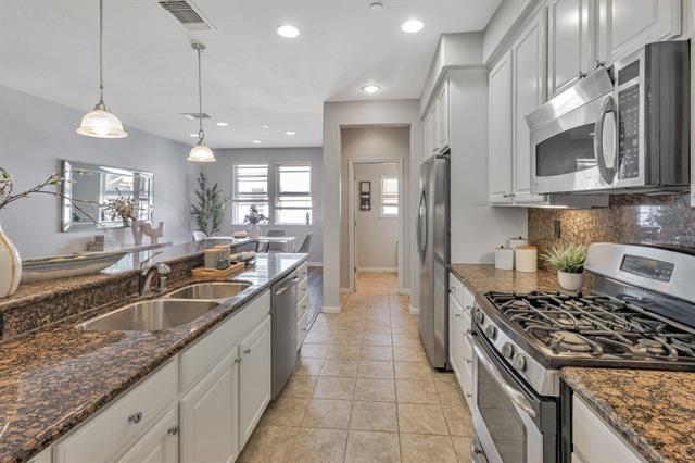 907 Rancho Place San Jose, CA 95126 - Photo 9 of 31 a kitchen with stainless steel appliances granite countertop a sink and a stove