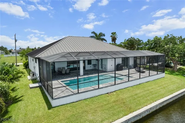 a view of a house with a yard balcony and sitting area