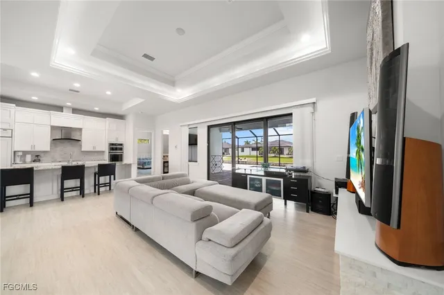 a living room with furniture fireplace and flat screen tv