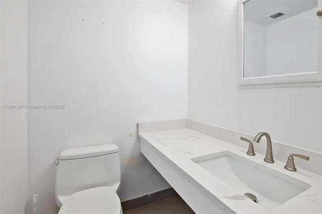 a bathroom with a sink and a toilet