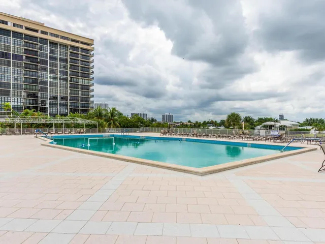 an aerial view of a house with a lake view