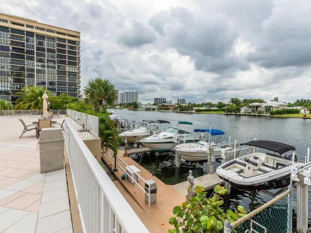 a roof deck with table and chairs