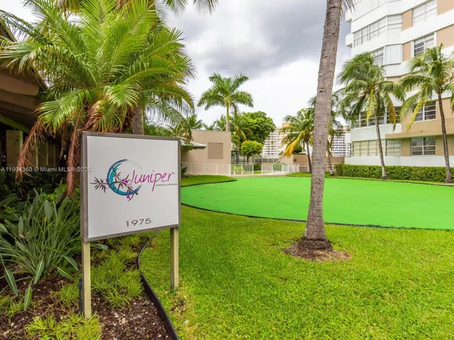 a sign board with a big yard