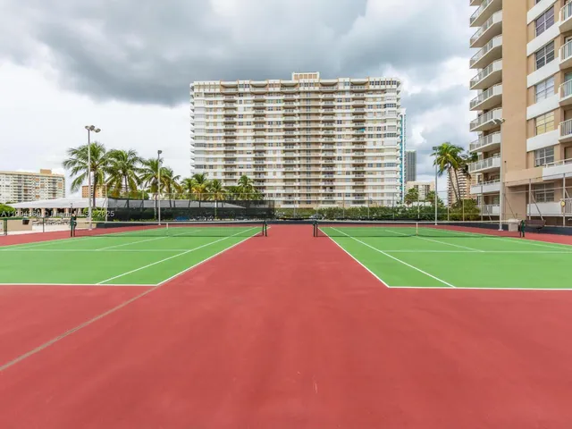 a view of a building with a yard