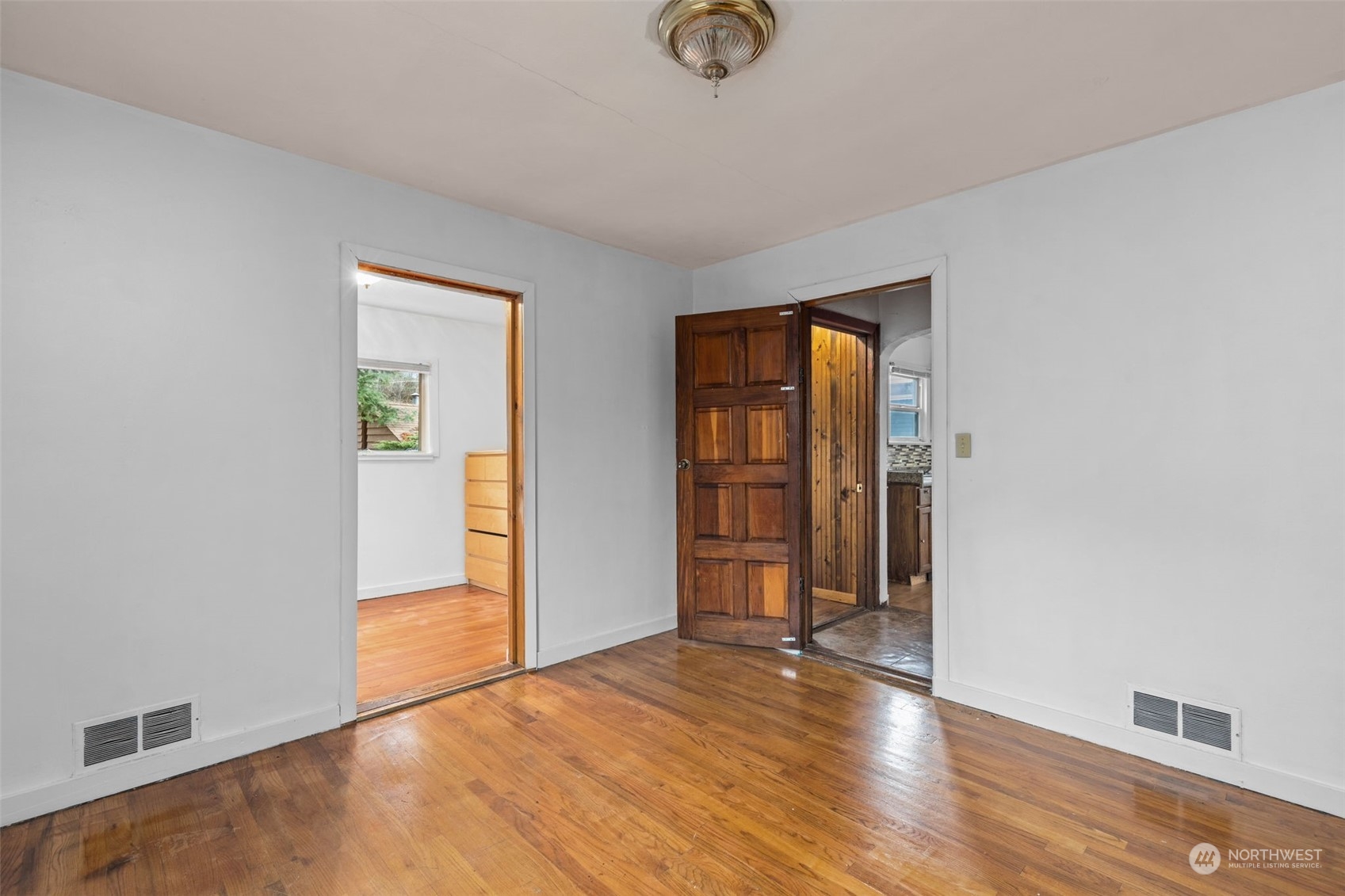666 Sunset Boulevard Northeast Renton, WA 98056 - Photo 16 of 39 an empty room with wooden floor and closet