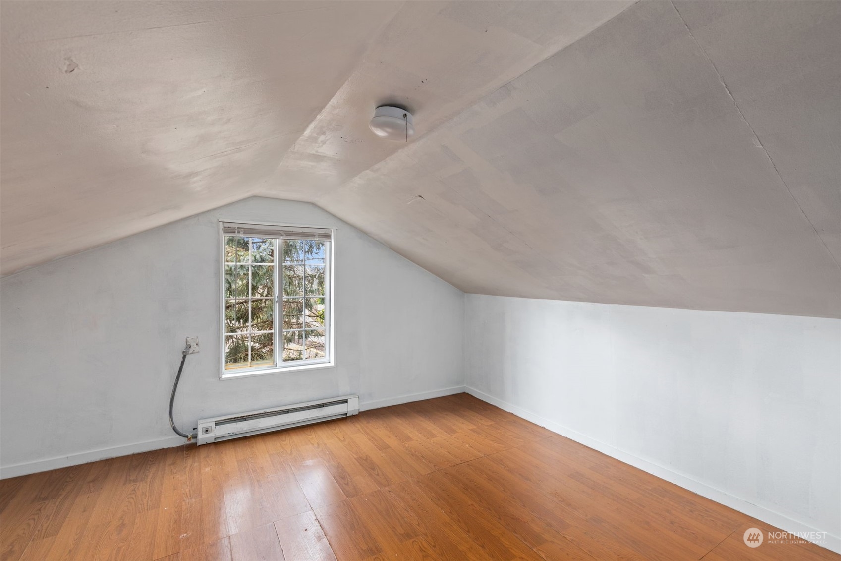 666 Sunset Boulevard Northeast Renton, WA 98056 - Photo 24 of 39 an empty room with wooden floor and windows