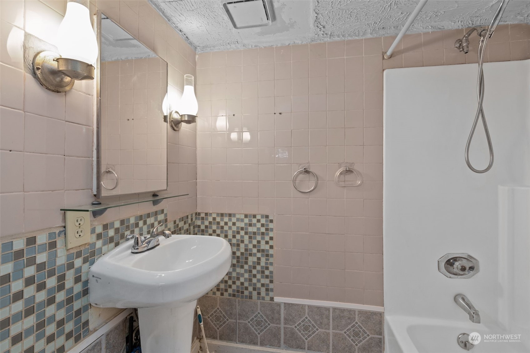 666 Sunset Boulevard Northeast Renton, WA 98056 - Photo 34 of 39 a bathroom with a sink a toilet and shower