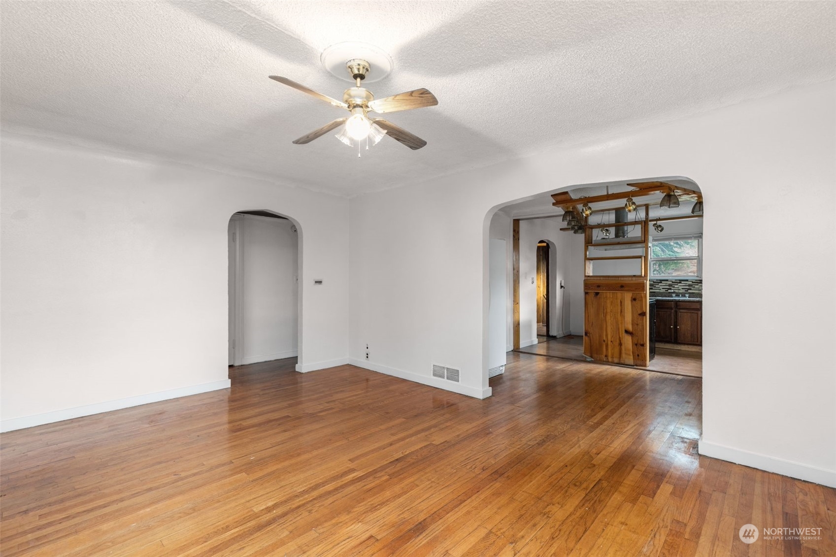 666 Sunset Boulevard Northeast Renton, WA 98056 - Photo 7 of 39 a view of a livingroom with wooden floor