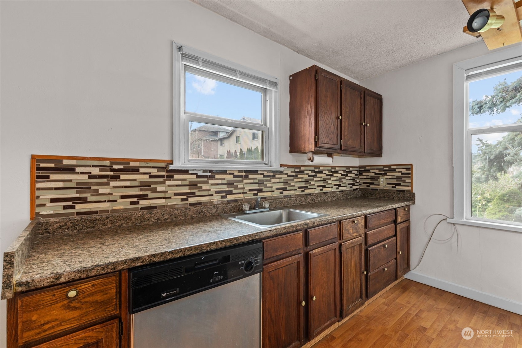 666 Sunset Boulevard Northeast Renton, WA 98056 - Photo 10 of 39 a kitchen with a sink and cabinets
