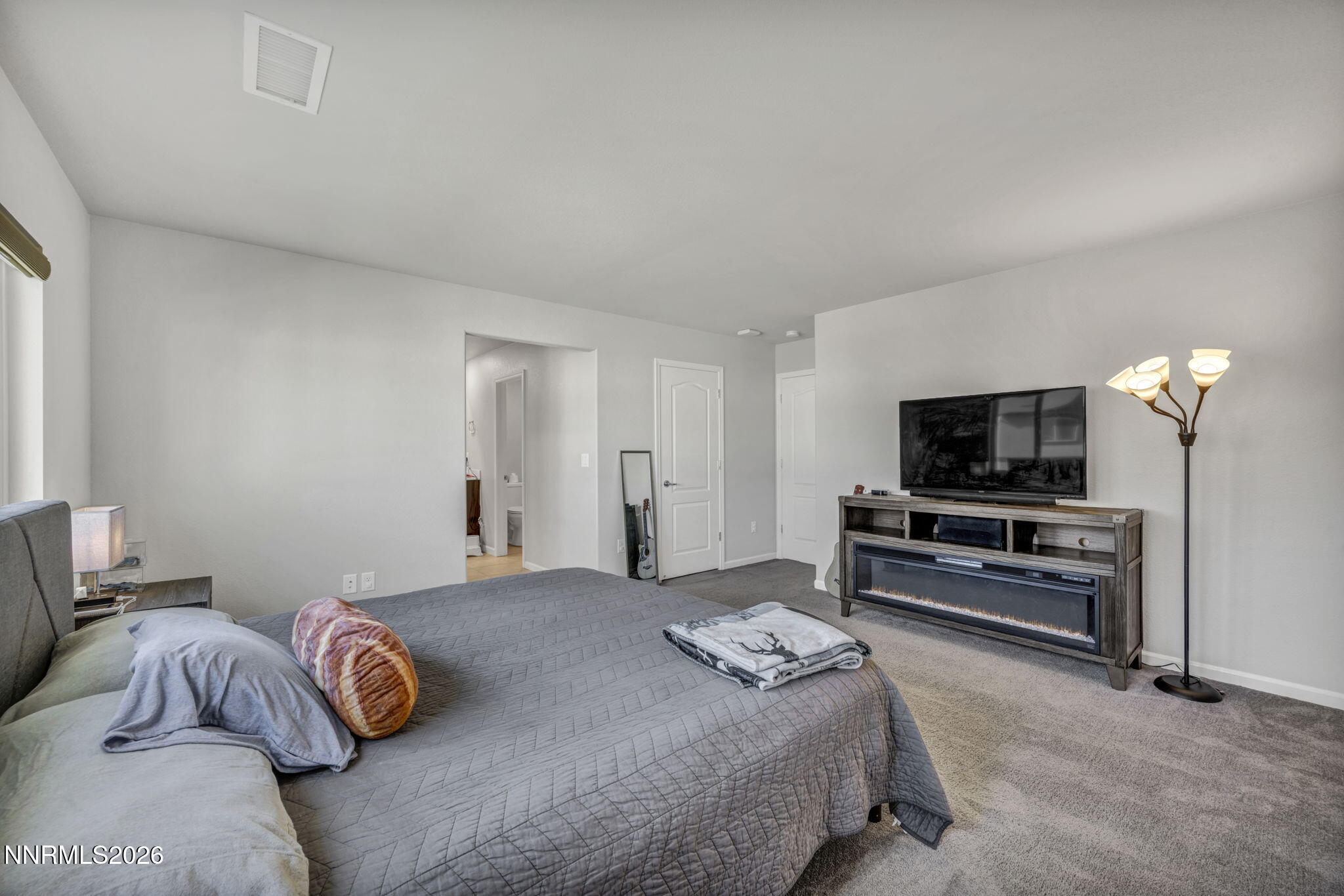 8850 Finnsech Drive Reno, NV 89506 - Photo 12 of 56 a bedroom with a bed and a television