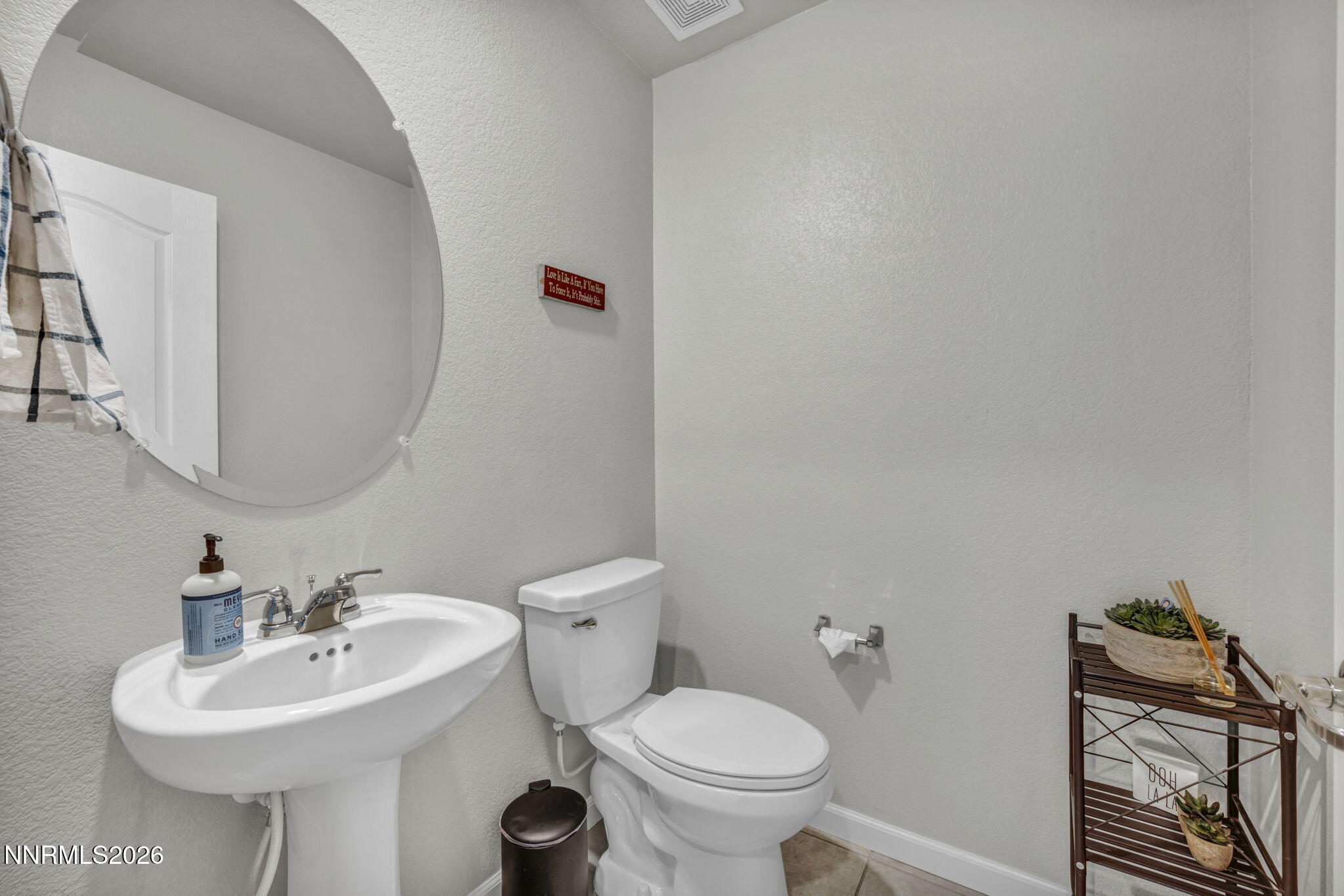 8850 Finnsech Drive Reno, NV 89506 - Photo 19 of 56 a bathroom with a sink toilet and a mirror