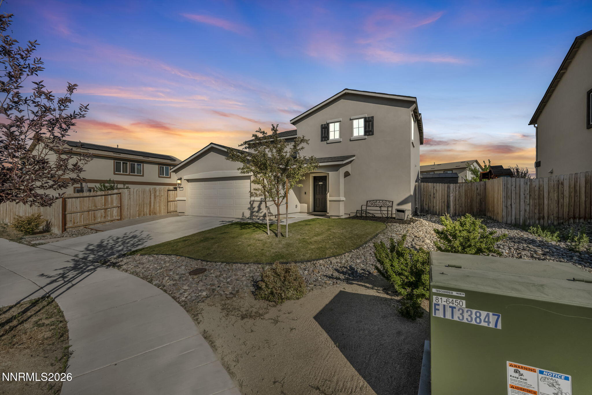 8850 Finnsech Drive Reno, NV 89506 - Photo 2 of 56 a front view of a house with a yard