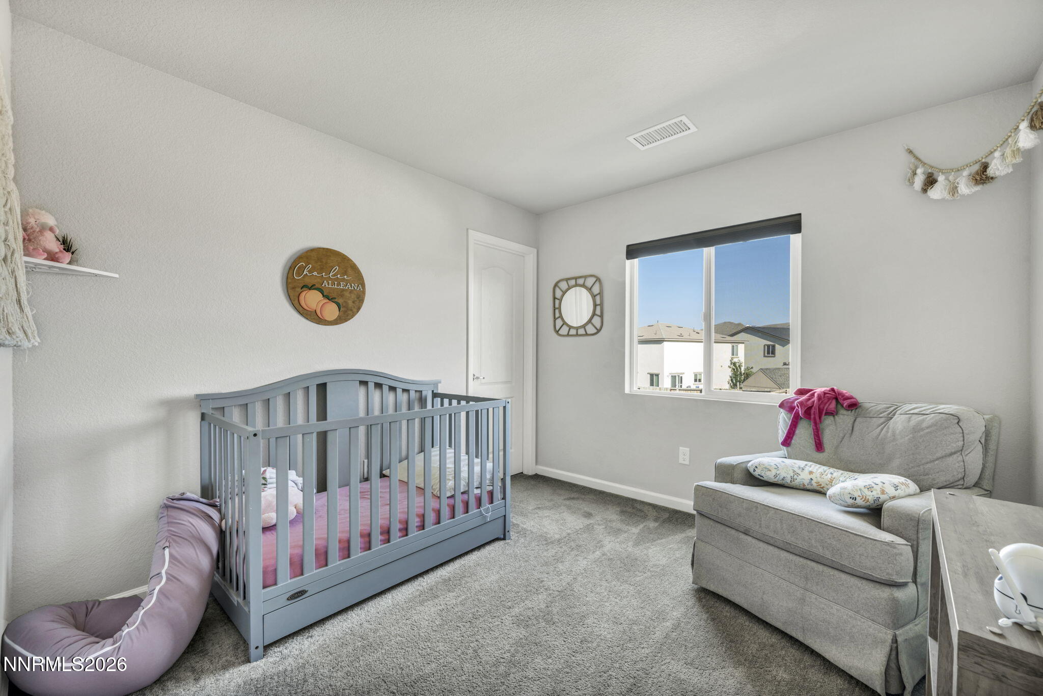 8850 Finnsech Drive Reno, NV 89506 - Photo 21 of 56 a bedroom with furniture and a window