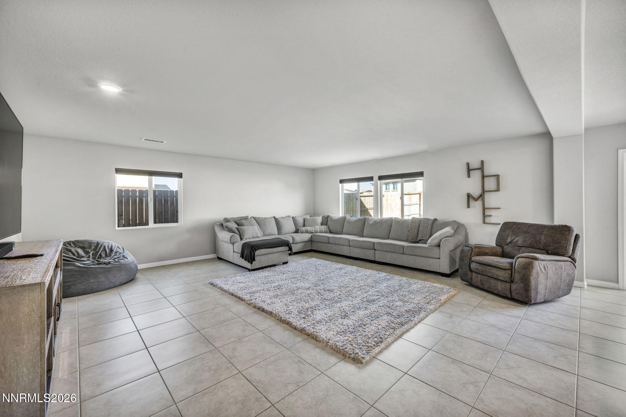 8850 Finnsech Drive Reno, NV 89506 - Photo 27 of 56 a living room with furniture and a couch