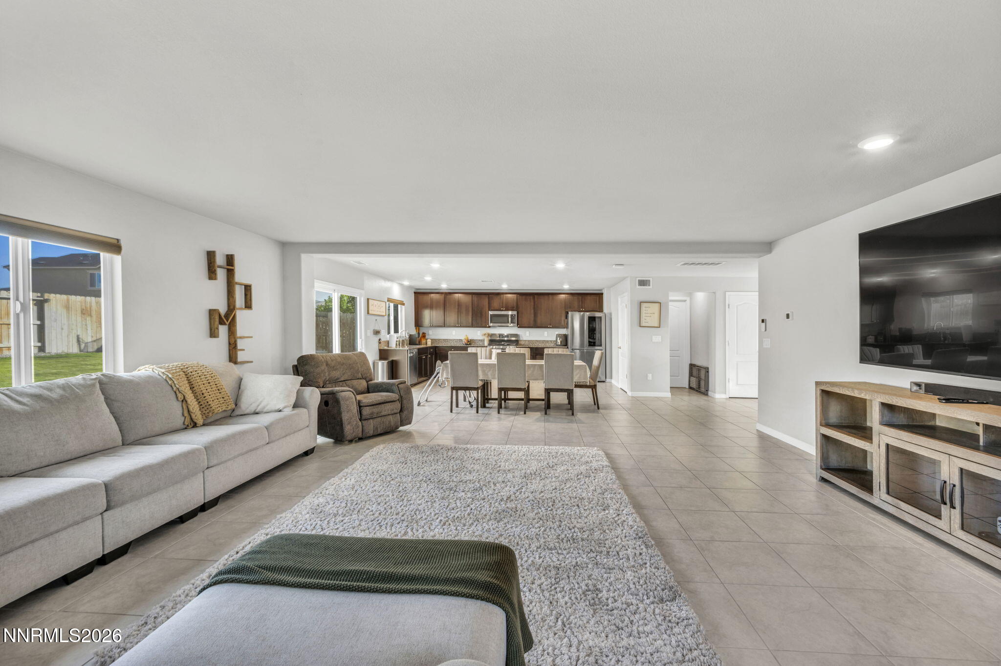 8850 Finnsech Drive Reno, NV 89506 - Photo 28 of 56 a living room with furniture and a flat screen tv