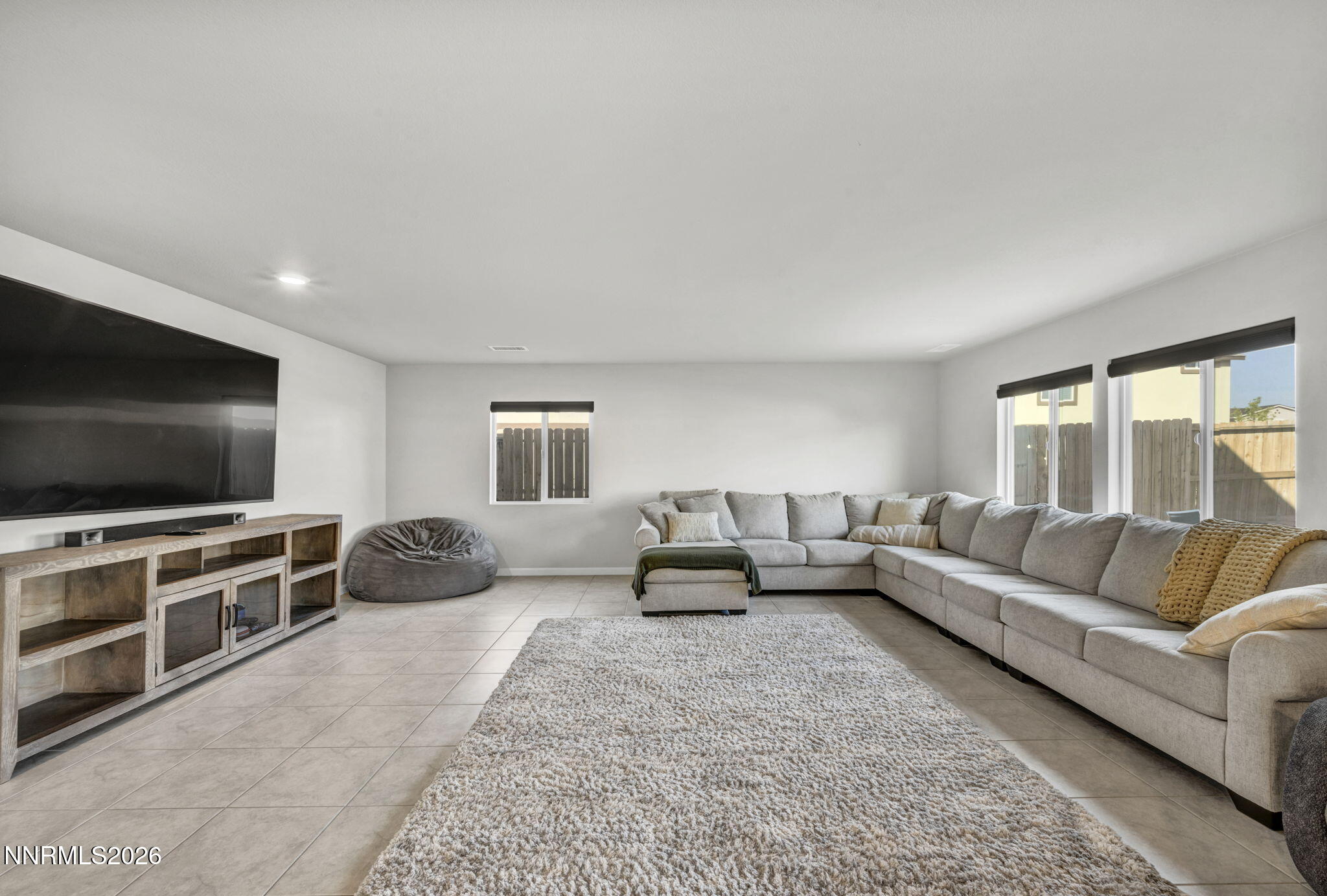 8850 Finnsech Drive Reno, NV 89506 - Photo 29 of 56 a living room with furniture and a flat screen tv