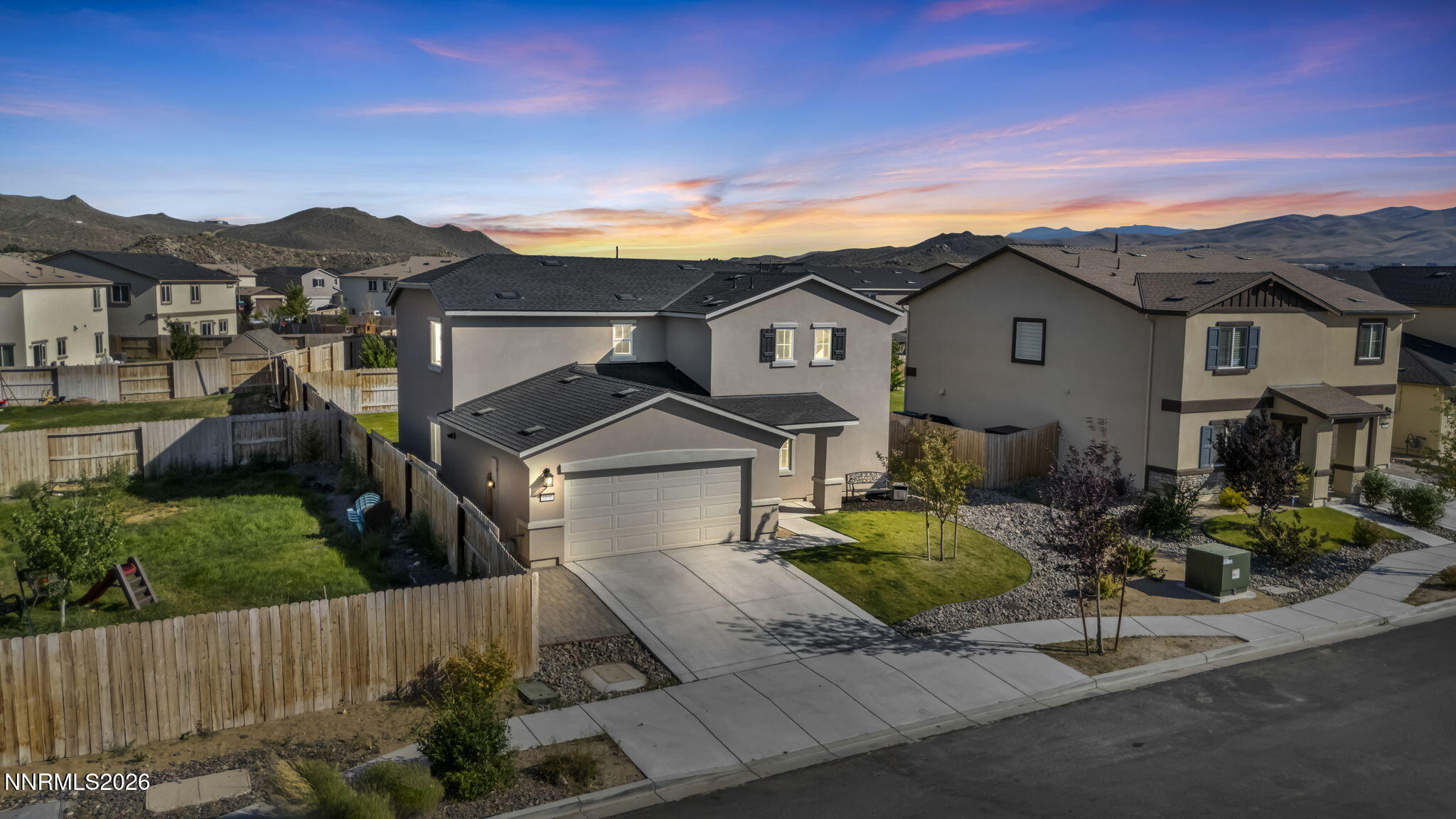 8850 Finnsech Drive Reno, NV 89506 - Photo 36 of 56 a front view of a house with a yard