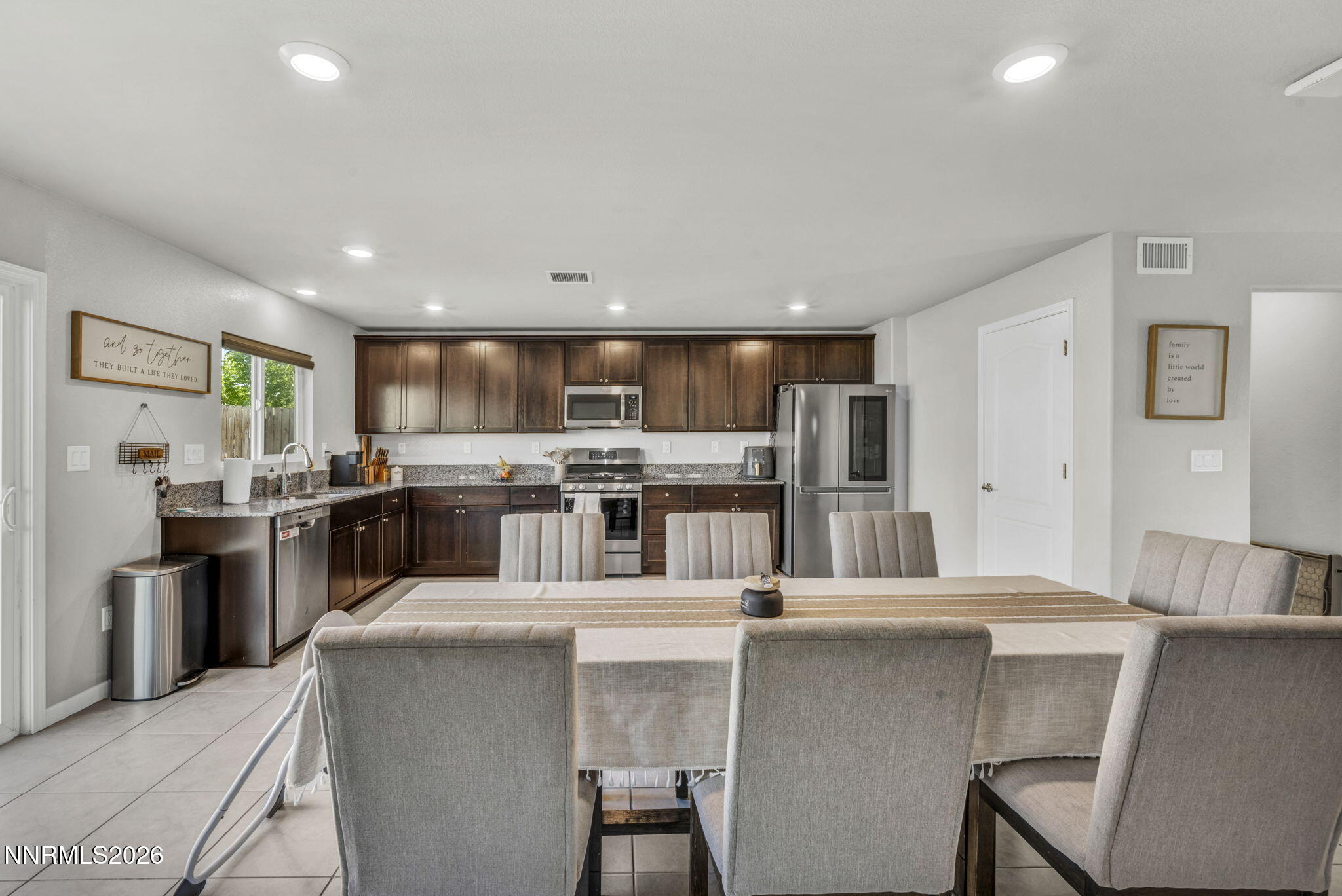 8850 Finnsech Drive Reno, NV 89506 - Photo 4 of 56 a kitchen with counter top space cabinets and stainless steel appliances