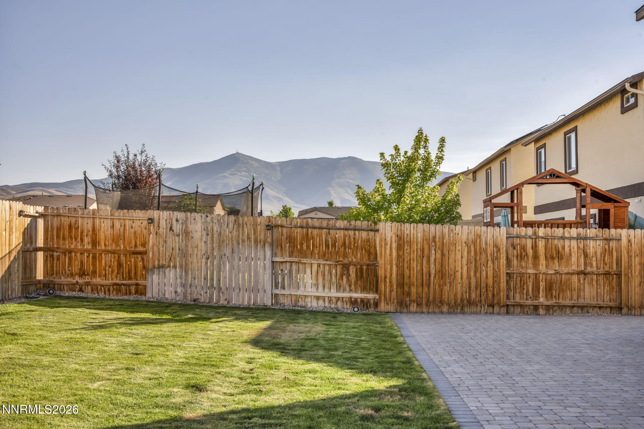 8850 Finnsech Drive Reno, NV 89506 - Photo 44 of 56 a view of a garden with wooden fence