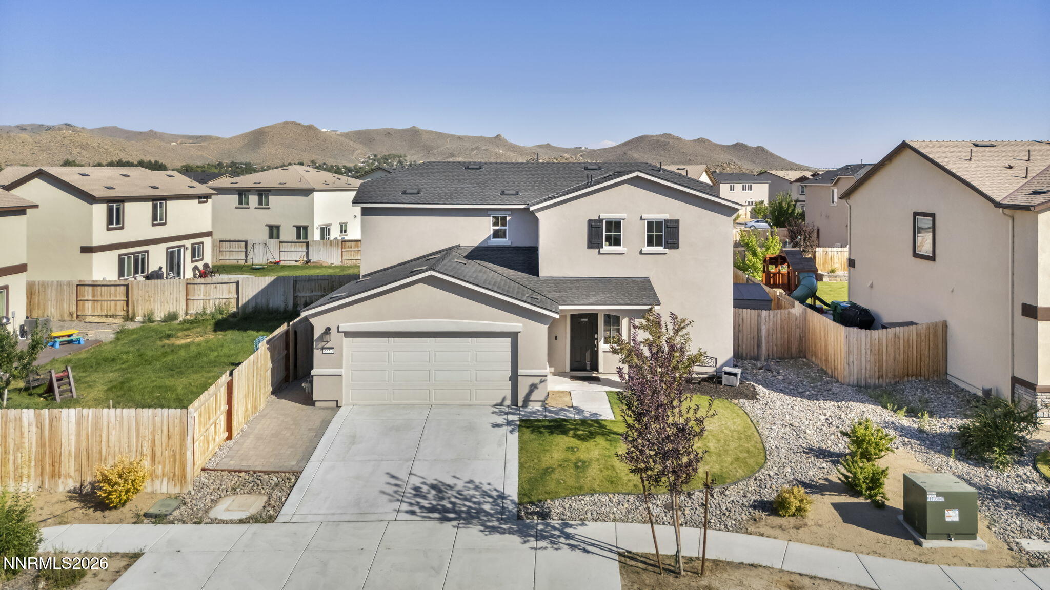 8850 Finnsech Drive Reno, NV 89506 - Photo 46 of 56 a front view of a house with a yard
