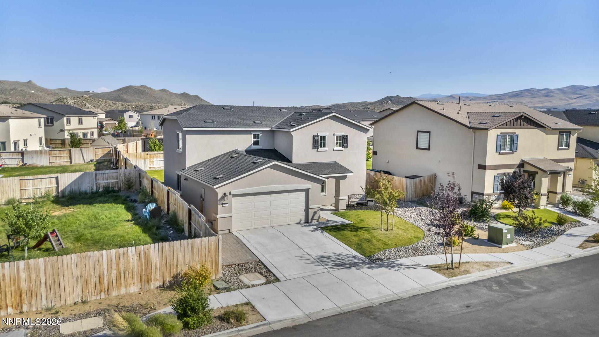8850 Finnsech Drive Reno, NV 89506 - Photo 48 of 56 a front view of a house with garden
