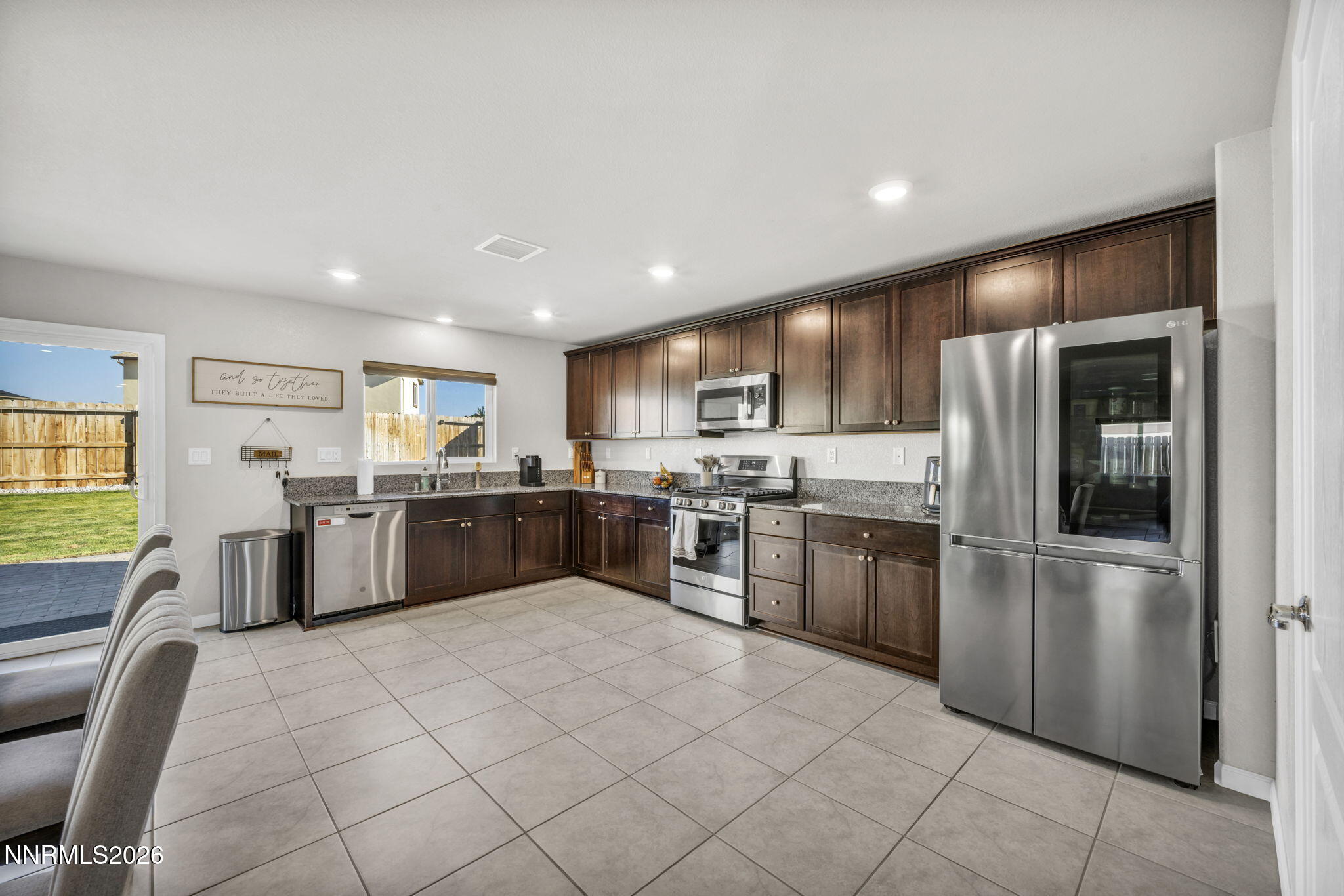 8850 Finnsech Drive Reno, NV 89506 - Photo 5 of 56 a kitchen with a sink a counter top space stainless steel appliances and cabinets