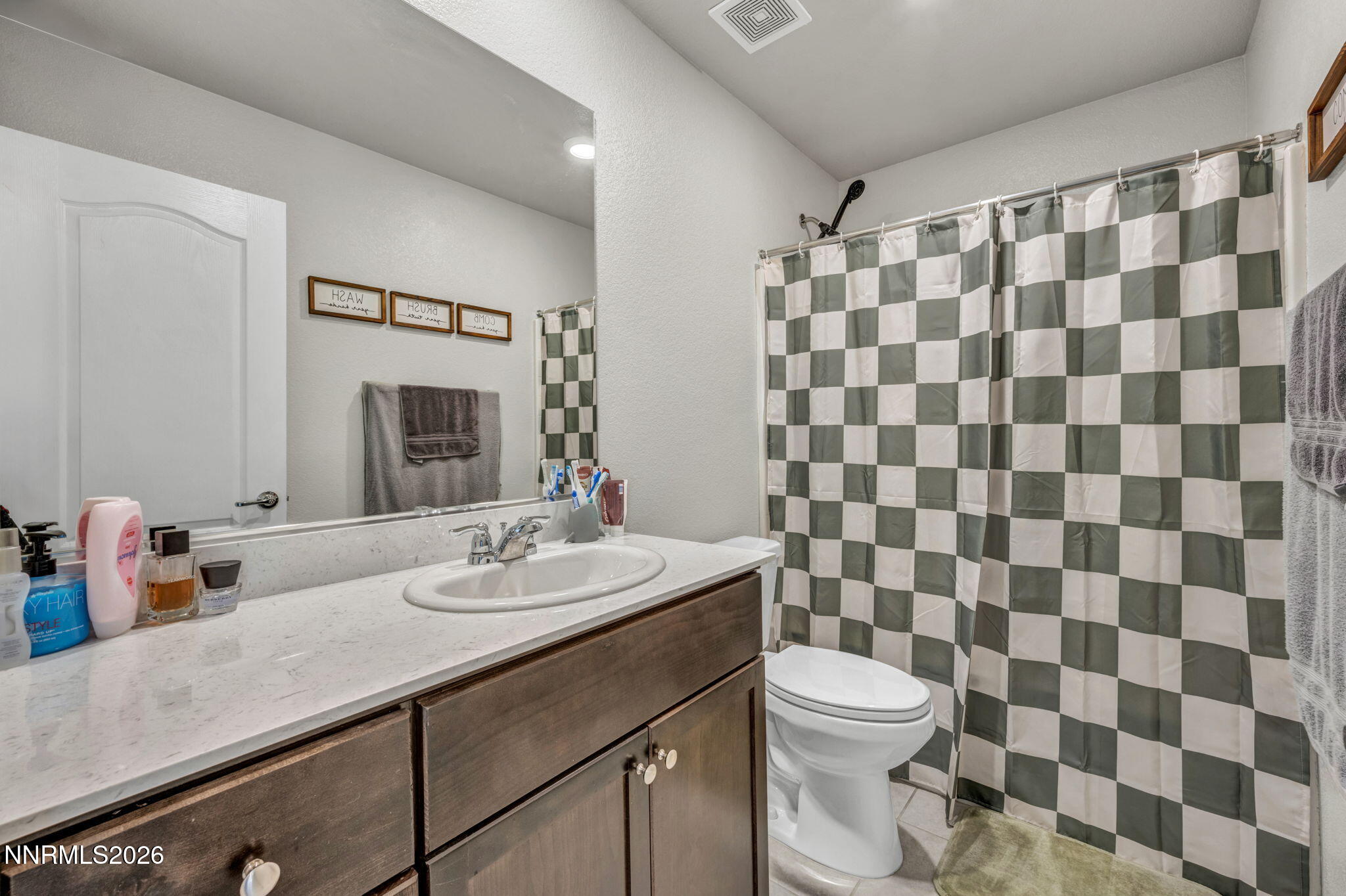 8850 Finnsech Drive Reno, NV 89506 - Photo 56 of 56 a bathroom with a sink and a mirror