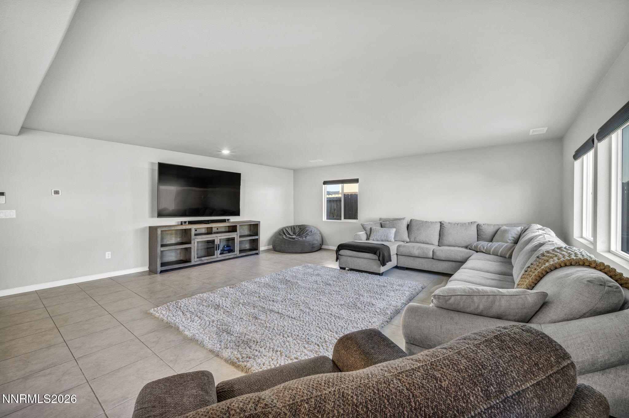 8850 Finnsech Drive Reno, NV 89506 - Photo 8 of 56 a living room with furniture and a flat screen tv