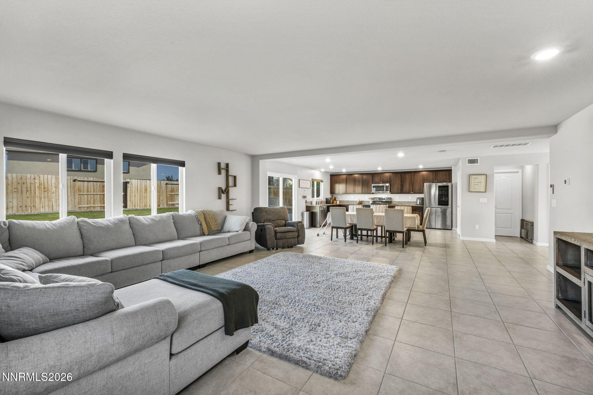 8850 Finnsech Drive Reno, NV 89506 - Photo 9 of 56 a living room with furniture and a flat screen tv