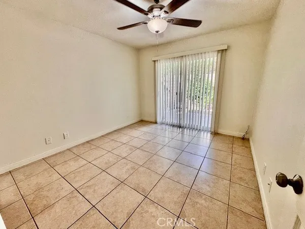 a view of an entryway with a chandelier fan