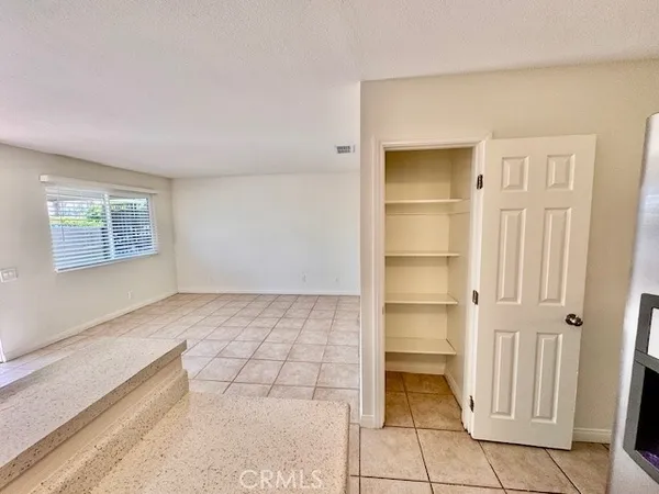 a view of an empty room and a window