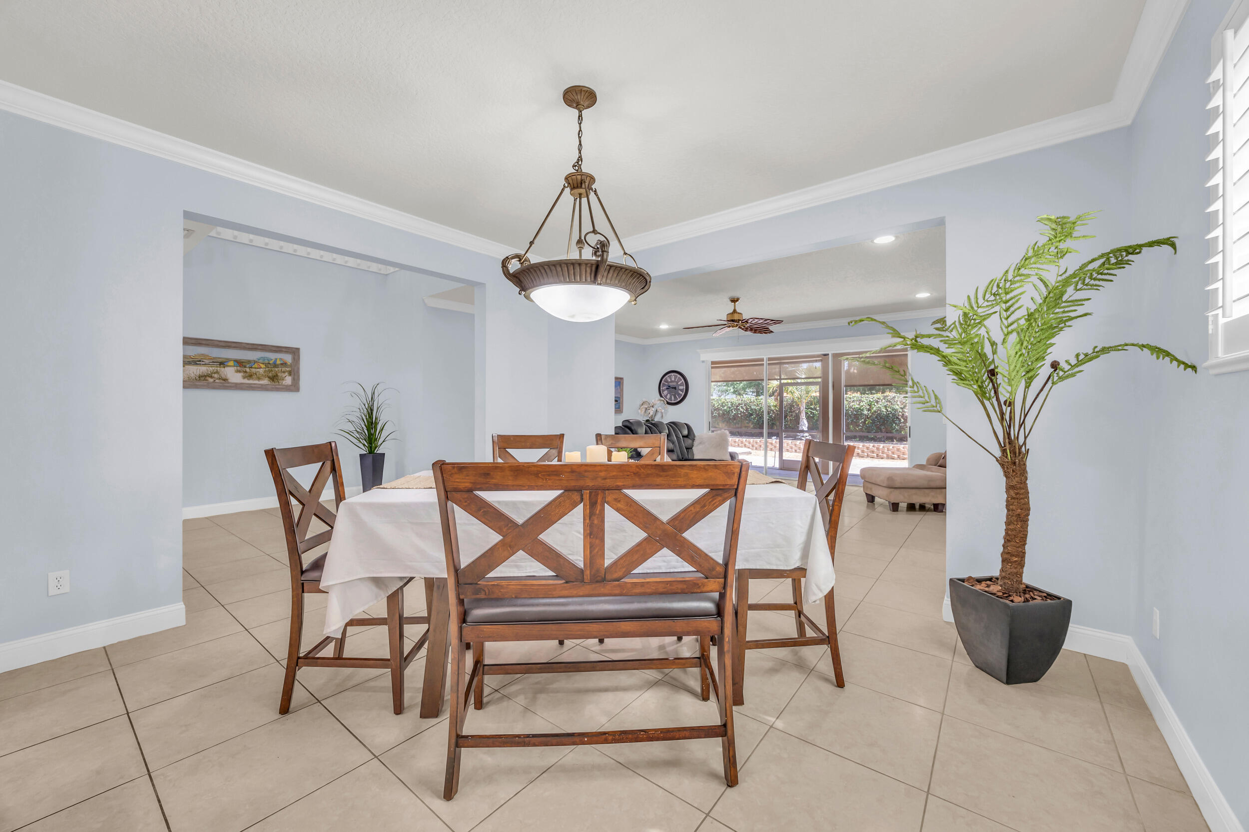 148 Cypress Cove Jupiter, FL 33458 - Photo 11 of 53 a view of a dining room with furniture and chandelier