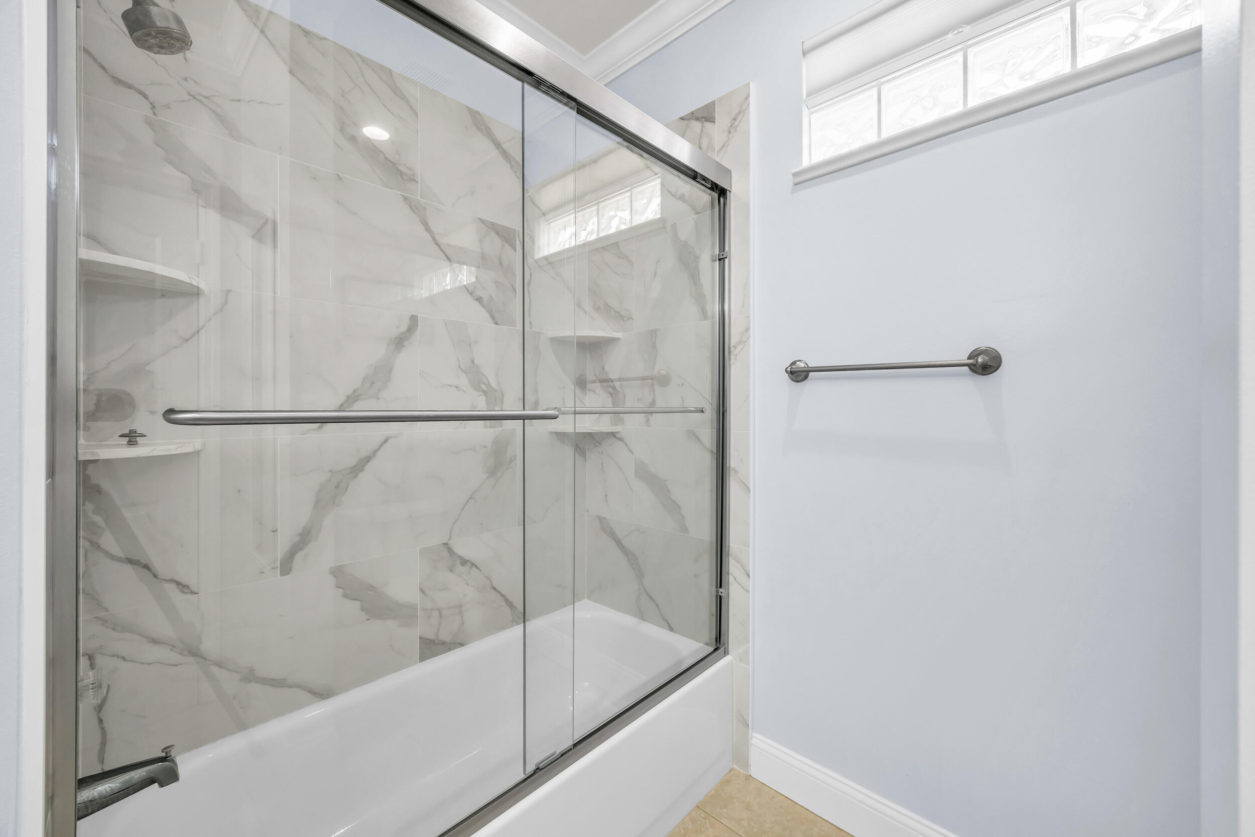 148 Cypress Cove Jupiter, FL 33458 - Photo 37 of 53 a bathroom with a bathtub and a shower