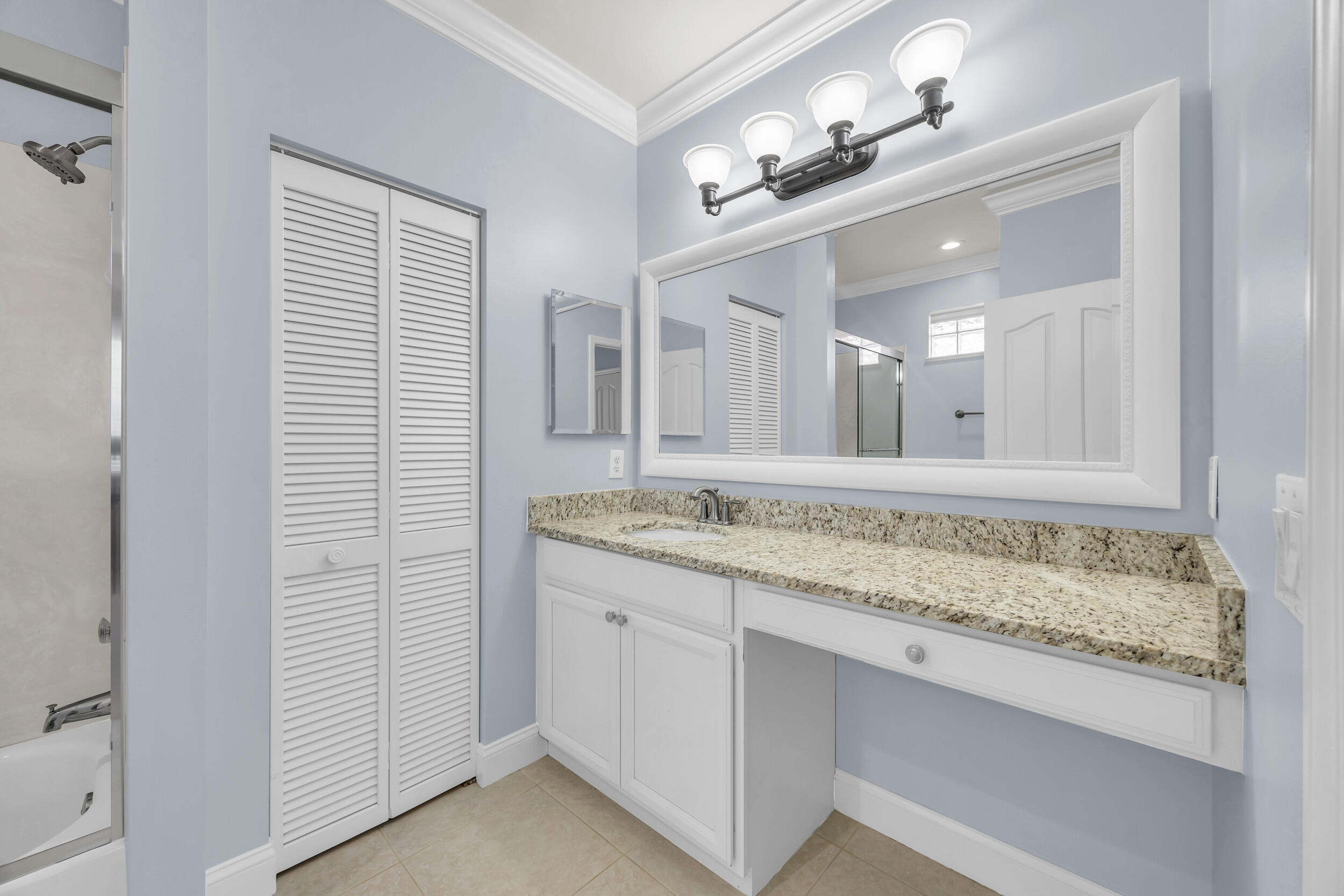 148 Cypress Cove Jupiter, FL 33458 - Photo 40 of 53 a bathroom with a granite countertop sink and a mirror