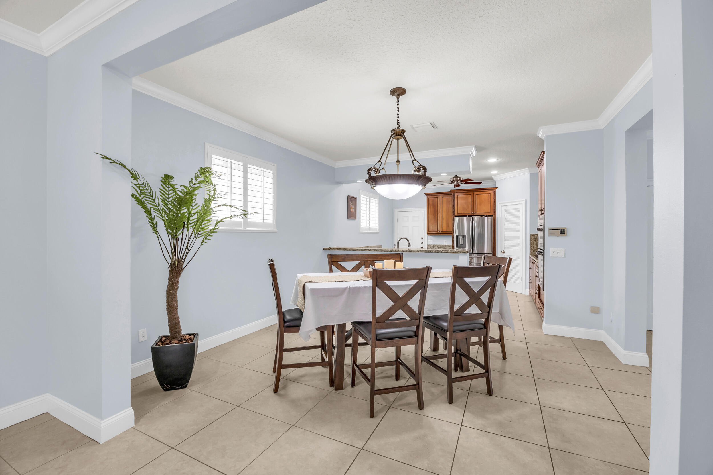 148 Cypress Cove Jupiter, FL 33458 - Photo 9 of 53 a view of a dining room with furniture