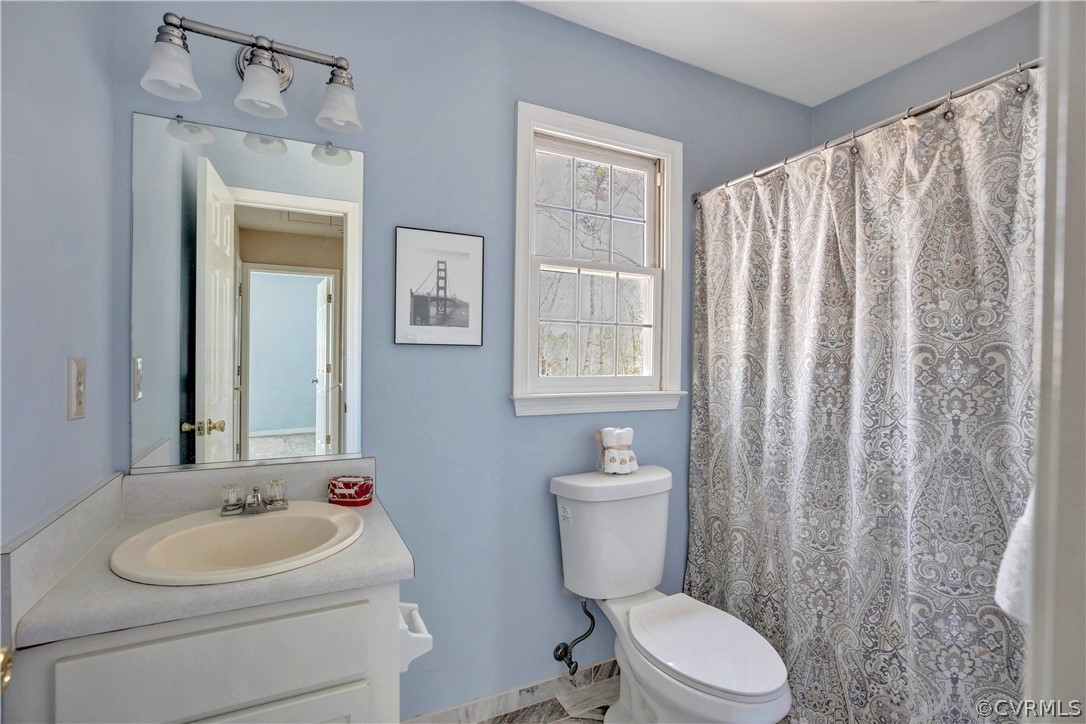 2300 Brookforest Road Midlothian, VA 23112 - Photo 20 of 29 a bathroom with a toilet sink and mirror