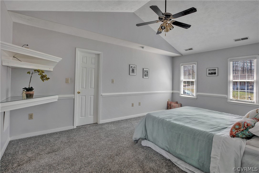 2300 Brookforest Road Midlothian, VA 23112 - Photo 21 of 29 a bedroom with a bed and a chandelier fan