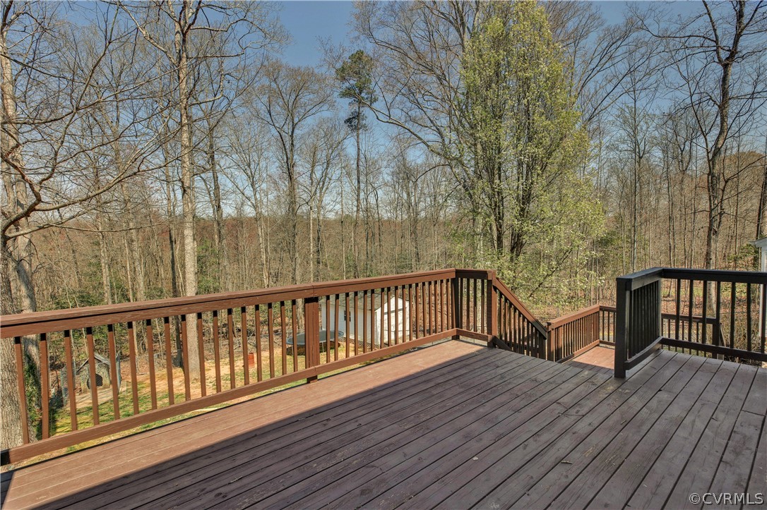 2300 Brookforest Road Midlothian, VA 23112 - Photo 24 of 29 a balcony with wooden floor and trees