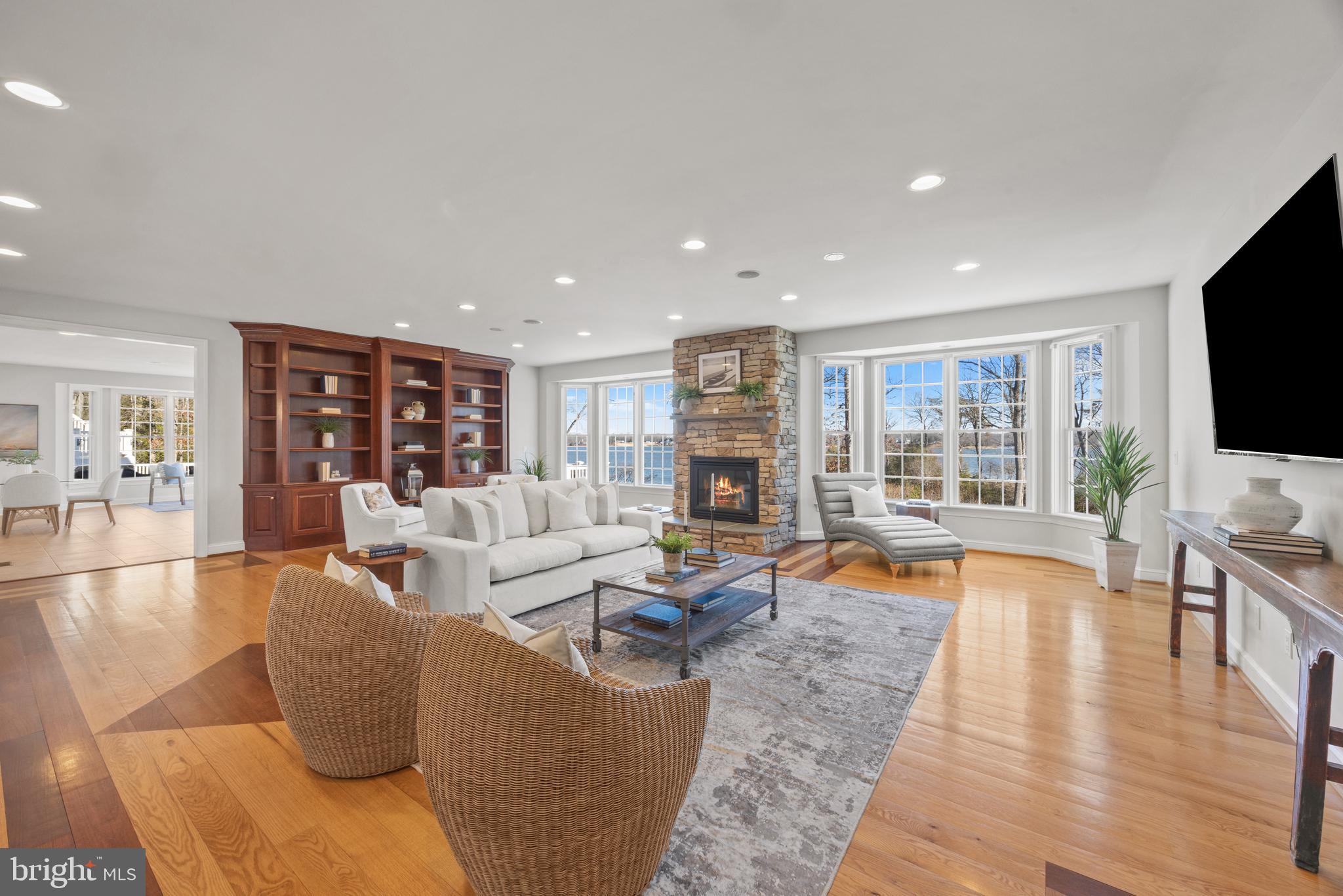 3317 Old Cedar Point Road Edgewater, MD 21037 - Photo 10 of 48 Family room with endless water views & fireplace