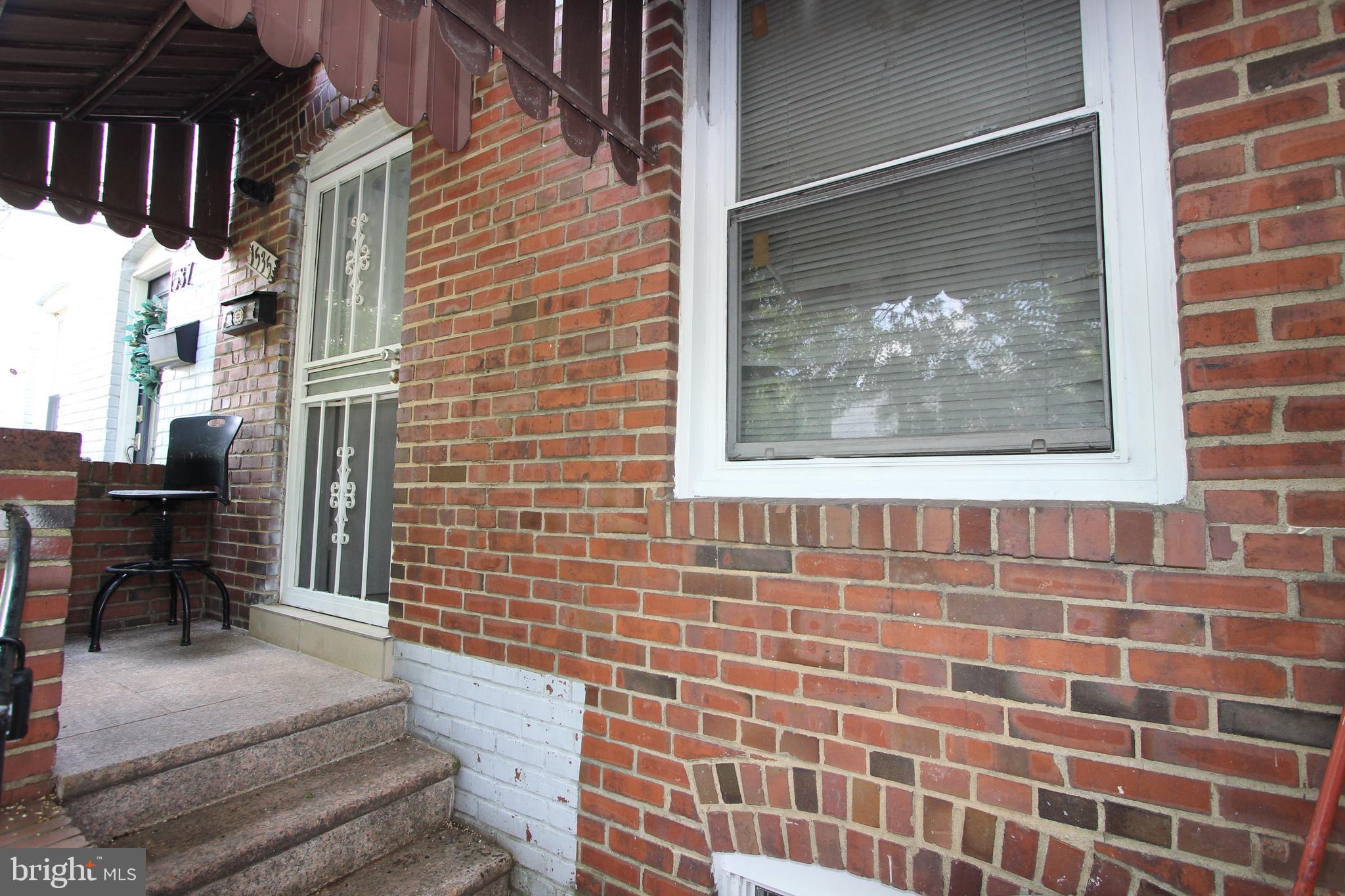 a view of a brick buildings with entryway