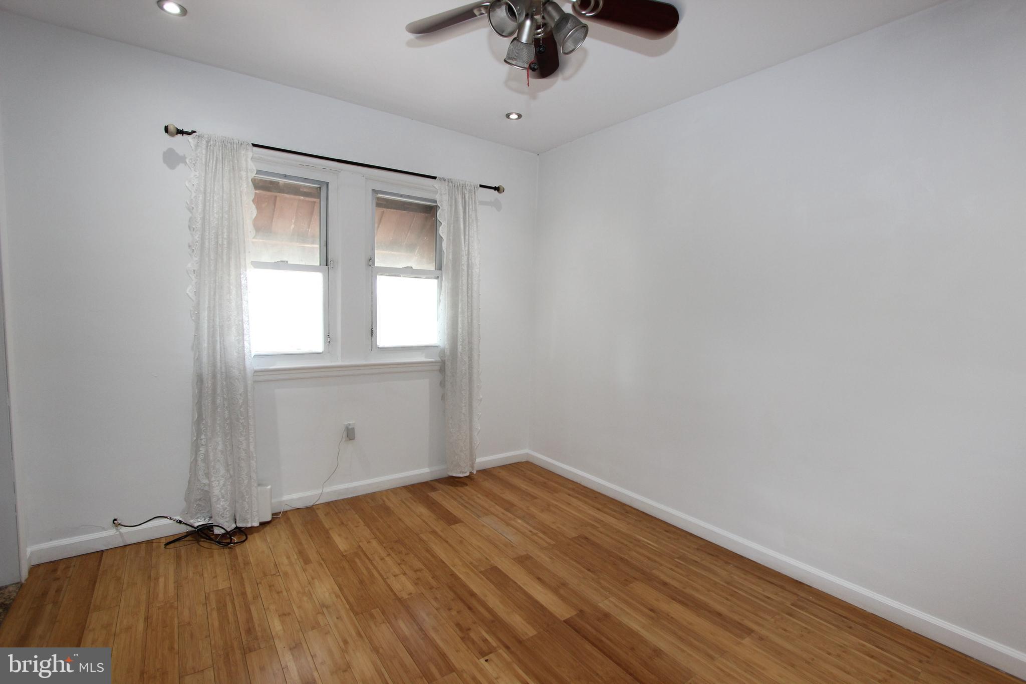 1535 K Street Southeast Washington, DC 20003 - Photo 14 of 21 a view of empty room with wooden floor and fan
