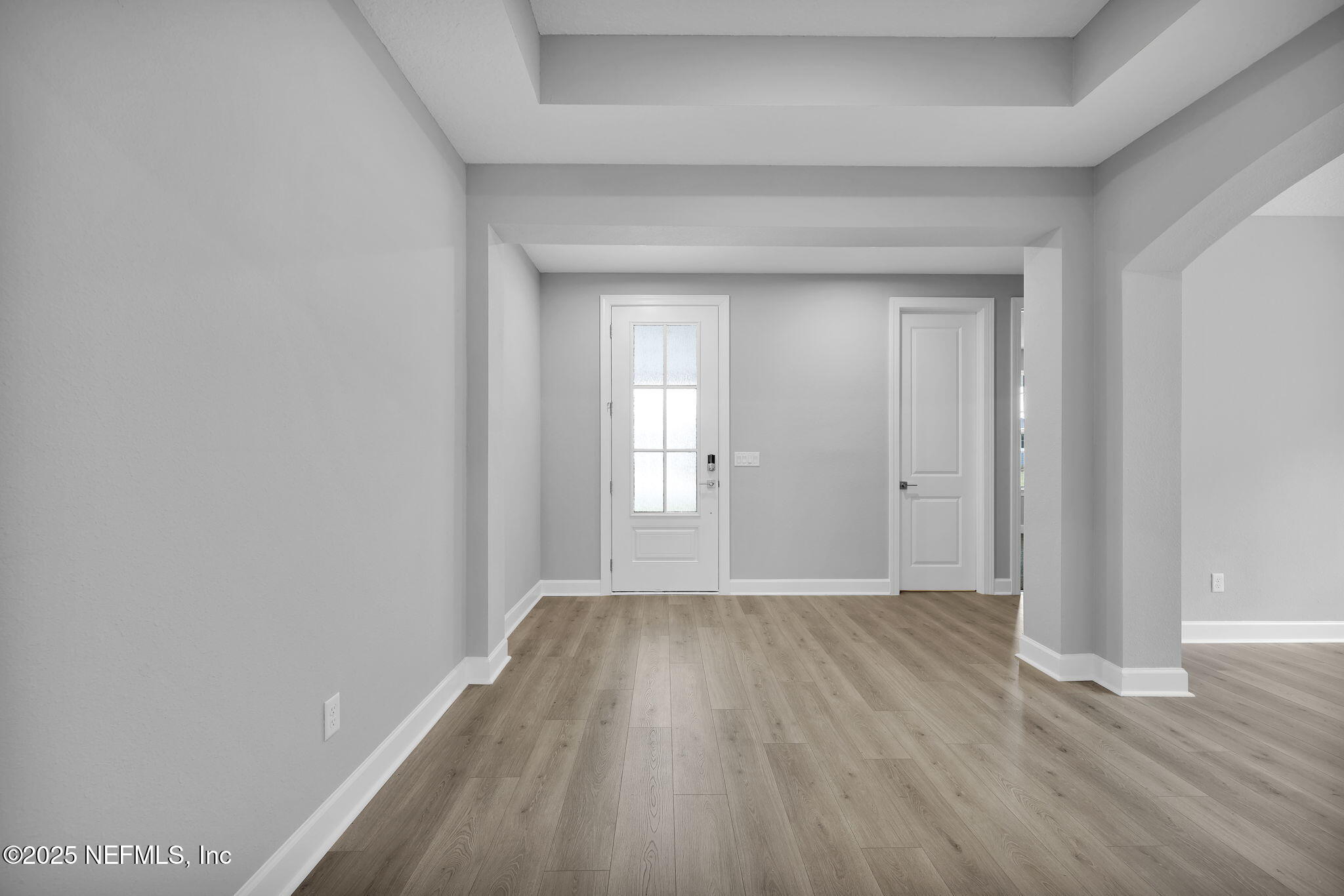 39 Greylock Lane St. Augustine, FL 32092 - Photo 14 of 54 an empty room with wooden floor and windows