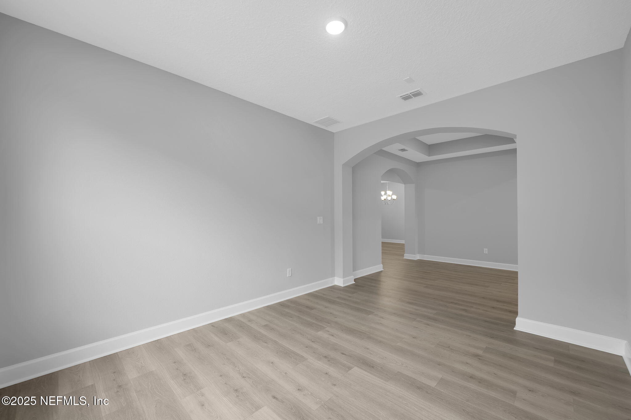 39 Greylock Lane St. Augustine, FL 32092 - Photo 16 of 54 a view of an empty room with wooden floor